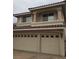 Close up of beige two car garage with neutral colored brick paver driveway at 4481 Grey Spencer Dr, Las Vegas, NV 89141