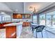 Cozy breakfast nook with granite countertops, custom cabinetry, and outdoor views at 4481 Grey Spencer Dr, Las Vegas, NV 89141
