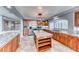 Bright, modern kitchen with stainless steel appliances, granite countertops, and a center island at 4481 Grey Spencer Dr, Las Vegas, NV 89141
