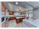 Gourmet kitchen featuring stainless steel appliances, a center island, and granite countertops at 4481 Grey Spencer Dr, Las Vegas, NV 89141