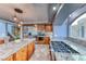 Modern kitchen featuring stainless steel appliances, a central island, and custom cabinetry at 4481 Grey Spencer Dr, Las Vegas, NV 89141