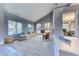 Bright living room featuring a vaulted ceiling, fireplace, and neutral tones at 4481 Grey Spencer Dr, Las Vegas, NV 89141