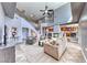Spacious living room with stone fireplace and a soaring staircase to the second floor at 4481 Grey Spencer Dr, Las Vegas, NV 89141