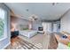 Large main bedroom with a fireplace, hardwood floors, and sitting area at 4481 Grey Spencer Dr, Las Vegas, NV 89141