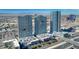 Aerial view of three high-rise buildings with city skyline and mountain views in the background at 4575 Dean Martin Dr # 1201, Las Vegas, NV 89103