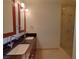 Modern bathroom features a double sink vanity with a luxurious, glass-enclosed walk-in shower at 4575 Dean Martin Dr # 1201, Las Vegas, NV 89103