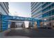 Grand entrance to the building, featuring elegant design elements and luxurious vehicle at 4575 Dean Martin Dr # 1201, Las Vegas, NV 89103