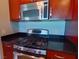 Stainless steel oven and microwave with dark countertop at 4575 Dean Martin Dr # 1201, Las Vegas, NV 89103