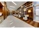 Contemporary lobby with wood paneled walls, built-in shelves, track lighting and modern white chairs at 4575 Dean Martin Dr # 1201, Las Vegas, NV 89103