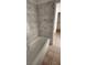 Bathroom featuring a bathtub with marble style tile surround at 503 Crony Ave, Henderson, NV 89011