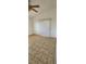 Bedroom with tile flooring, ceiling fan, and sliding glass door at 503 Crony Ave, Henderson, NV 89011