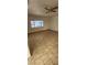Bedroom with tile flooring, ceiling fan, and a bright window at 503 Crony Ave, Henderson, NV 89011
