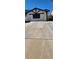 Charming home with a driveway and unique architectural details in the front at 503 Crony Ave, Henderson, NV 89011
