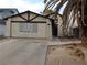 Charming single-story home with stucco exterior, attached garage, and mature palm tree in the front yard at 503 Crony Ave, Henderson, NV 89011