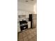 Kitchen view showcasing a stainless steel stove, oven, refrigerator, and white cabinets at 503 Crony Ave, Henderson, NV 89011
