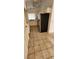 Galley kitchen features white cabinets and stainless steel refrigerator at 503 Crony Ave, Henderson, NV 89011