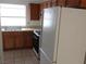 Functional kitchen with standard appliances, wood cabinets, and ample counter space for meal preparation at 503 Crony Ave, Henderson, NV 89011