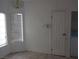 Convenient laundry area inside the home, featuring a modern light fixture and washer/dryer hookups at 503 Crony Ave, Henderson, NV 89011