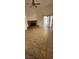Bright living room features brick fireplace, tile floors, and sliding glass doors at 503 Crony Ave, Henderson, NV 89011