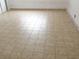 Open room showcasing neutral-toned tile flooring and freshly painted walls at 503 Crony Ave, Henderson, NV 89011