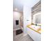 Bathroom with a wood-accent wall, modern sink, and a shower-tub combo at 5250 S Rainbow Blvd # 2033, Las Vegas, NV 89118