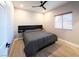 Bedroom featuring a gray comforter, black headboard with shelves and window at 5250 S Rainbow Blvd # 2033, Las Vegas, NV 89118