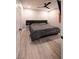 Bedroom with ceiling fan, light wood floors, large bed with padded headboard, and modern style at 5250 S Rainbow Blvd # 2033, Las Vegas, NV 89118