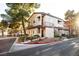 Two-story home with tan stucco, brown trim, and well-kept landscaping with a red fire hydrant at 5250 S Rainbow Blvd # 2033, Las Vegas, NV 89118