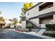 Apartment building exterior with stairs, landscaping, and well-maintained grounds at 5250 S Rainbow Blvd # 2033, Las Vegas, NV 89118