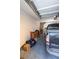 A two-car garage with a truck parked inside and stairway in the background at 5250 S Rainbow Blvd # 2033, Las Vegas, NV 89118