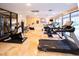 Bright community gym features multiple treadmills, bikes, and a weight machine on a sunny day at 5250 S Rainbow Blvd # 2033, Las Vegas, NV 89118
