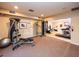 Community gym with weights, stationary bikes, and carpeted floors at 5250 S Rainbow Blvd # 2033, Las Vegas, NV 89118