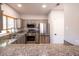 Kitchen featuring granite countertops, stainless steel appliances, and ample cabinet space at 5250 S Rainbow Blvd # 2033, Las Vegas, NV 89118
