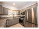 Spacious kitchen with stainless steel appliances, granite counters, and plenty of cabinet storage at 5250 S Rainbow Blvd # 2033, Las Vegas, NV 89118