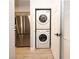 Convenient laundry area with stacked washer and dryer, located near the kitchen at 5250 S Rainbow Blvd # 2033, Las Vegas, NV 89118