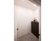 Walk-in closet features a dark wood dresser and overhead lighting at 5250 S Rainbow Blvd # 2033, Las Vegas, NV 89118