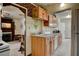 Bright kitchen featuring wooden cabinets, laminate countertops, and an adjoining living space at 537 Avenue I, Boulder City, NV 89005