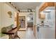 Classic kitchen featuring white appliances, wood cabinets, and view to living room at 537 Avenue I, Boulder City, NV 89005