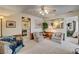 Bright living room with neutral tones, a ceiling fan, and a view into the adjacent rooms at 537 Avenue I, Boulder City, NV 89005