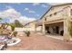 Large backyard with covered patio, desert landscaping and rock water feature at 5609 Hannah Gordon Ct, North Las Vegas, NV 89081