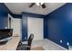 Bedroom featuring a ceiling fan, carpeted floors, and a comfortable workspace with an office setup at 5609 Hannah Gordon Ct, North Las Vegas, NV 89081