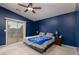 Bright bedroom with a sliding glass door, and a ceiling fan at 5609 Hannah Gordon Ct, North Las Vegas, NV 89081