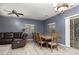 Dining area features wood-look flooring and updated chandelier at 5609 Hannah Gordon Ct, North Las Vegas, NV 89081