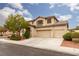 Charming two-story home featuring a well-maintained lawn and a two-car garage at 5609 Hannah Gordon Ct, North Las Vegas, NV 89081