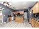 Modern kitchen with an island, stainless steel appliances, and wood cabinets at 5609 Hannah Gordon Ct, North Las Vegas, NV 89081