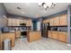 Modern kitchen with an island, stainless steel appliances, and wood cabinets at 5609 Hannah Gordon Ct, North Las Vegas, NV 89081