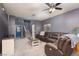 Comfortable living room with carpet flooring and a ceiling fan at 5609 Hannah Gordon Ct, North Las Vegas, NV 89081