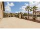 Spacious patio area with views of palm trees, nearby homes, and sunny blue skies at 5609 Hannah Gordon Ct, North Las Vegas, NV 89081