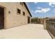 Large patio area with stucco walls and iron railing at 5609 Hannah Gordon Ct, North Las Vegas, NV 89081