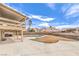 The expansive backyard features a kidney-shaped pool and a spacious covered patio with outdoor grill at 5751 E Owens Ave, Las Vegas, NV 89110